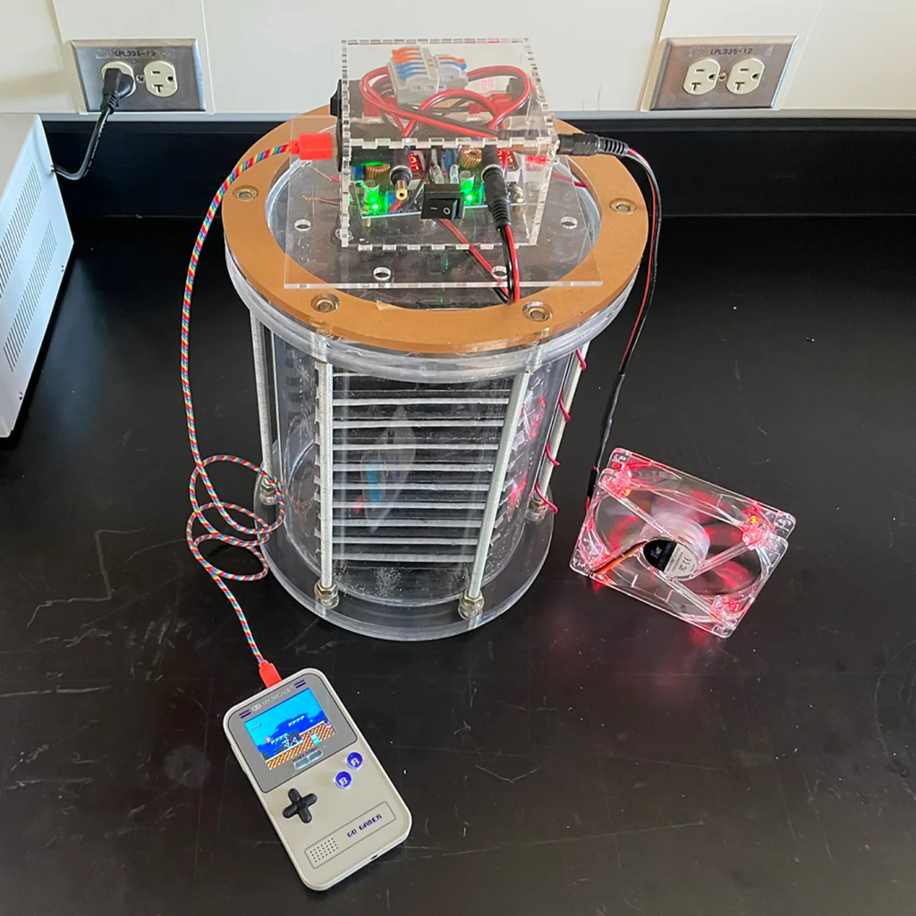Damian Stefaniuk has been able to use a carbon cement supercapacitor to power a handheld gaming device.