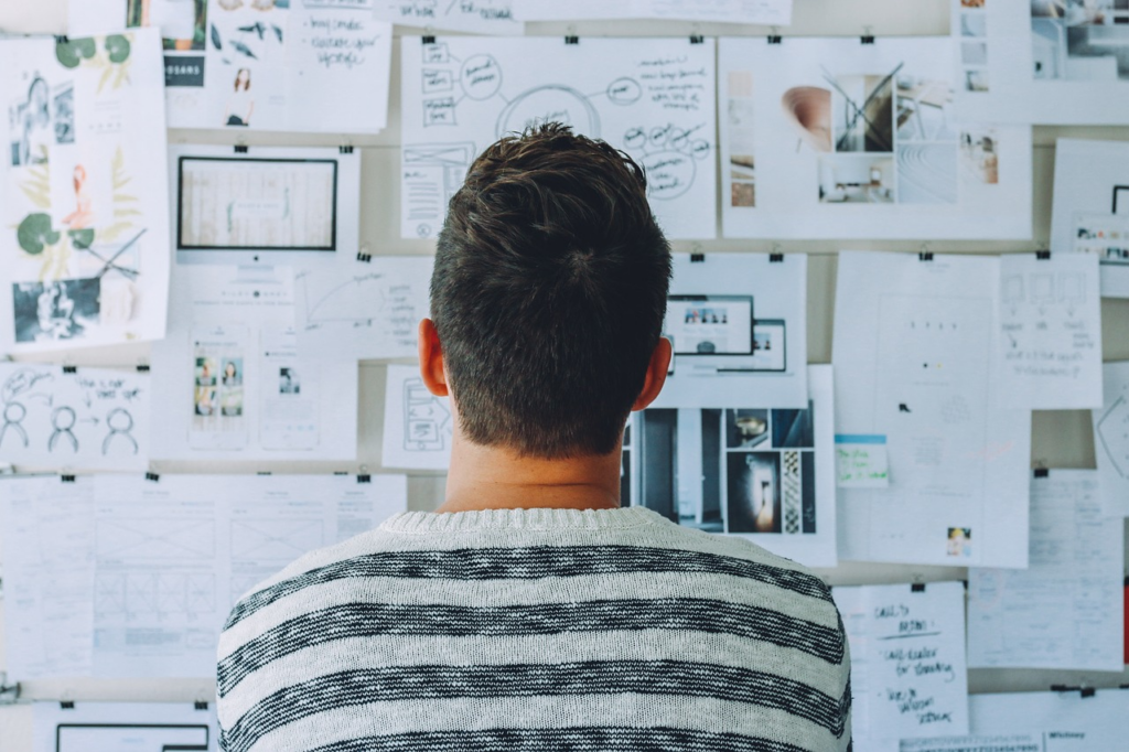 person looking at research notes