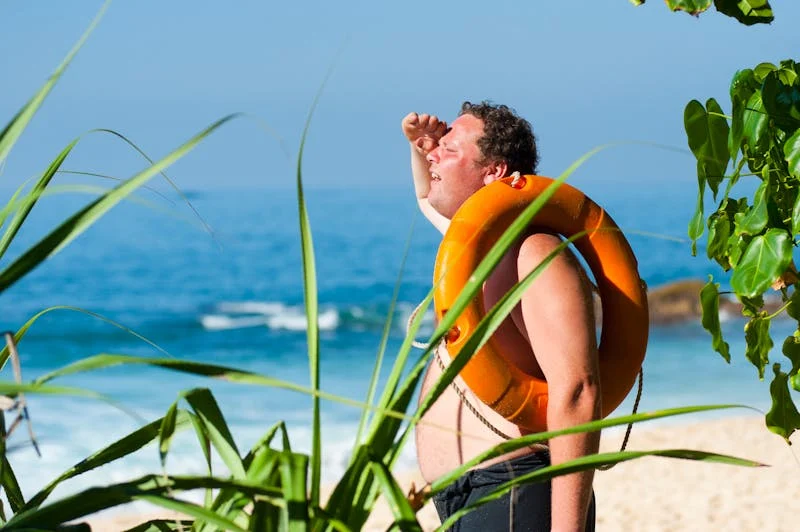 man in the sun on the beach