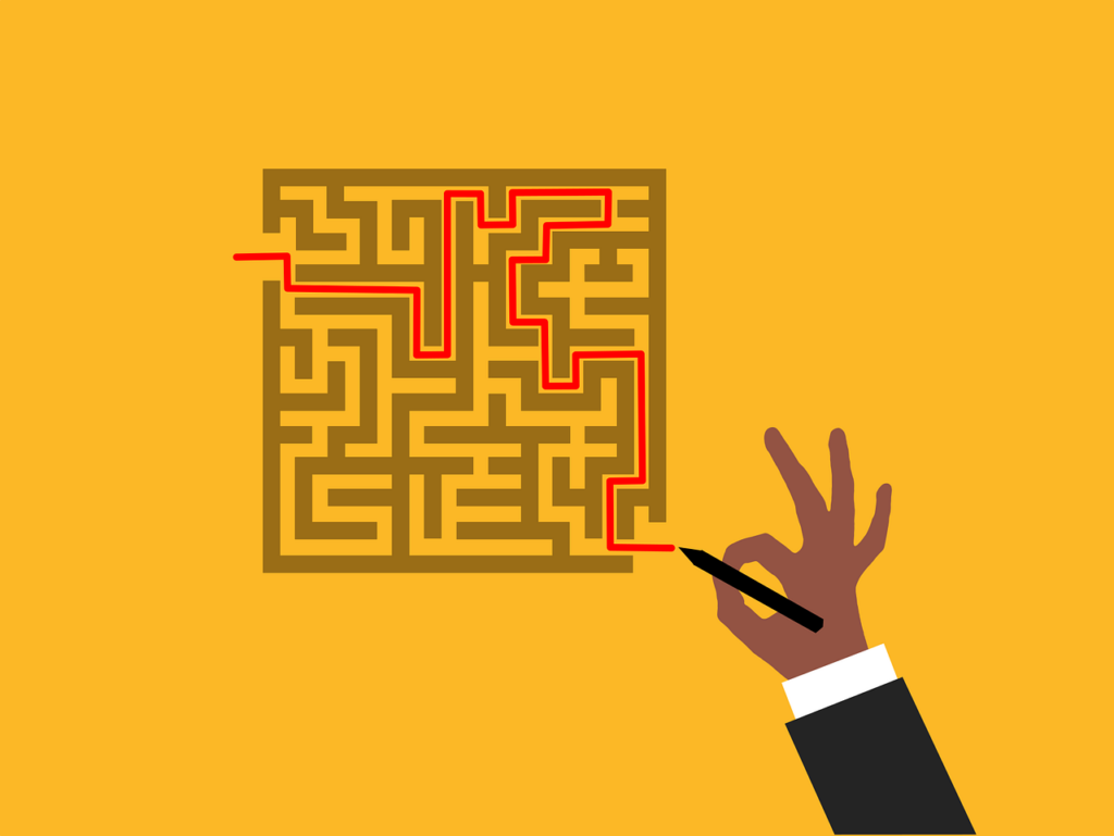 hand completing a maze