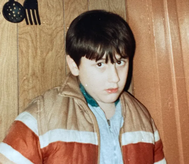 Semmel is pictured in elementary school, around the age he was singled out by a teacher for his tics