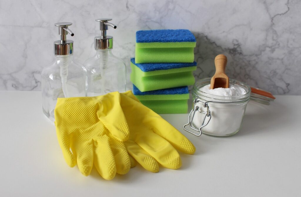 Cleaning supplies white and gray background. 