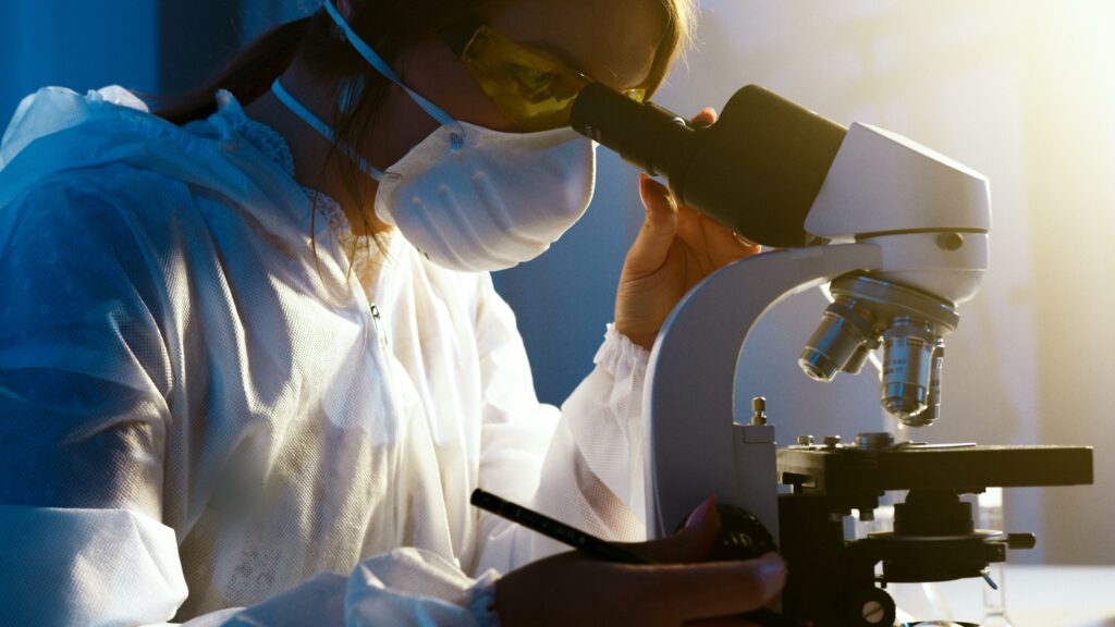 Photo Of Woman Looking Through microscope