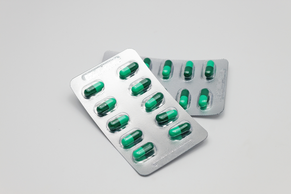 Capsule pills of drug name loperamide 2 MG for antidiarrheal isolated on white background with text copy space.
