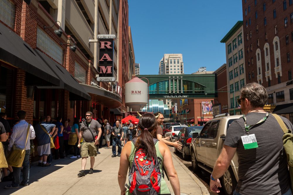 INDIANAPOLIS, INDIANA / USA - AUGUST 01 2015: Illinois Street in downtown Indianapolis, full of gamers attending the annual GenCon gaming convention. The RAM is a popular hangout for con attendees.
