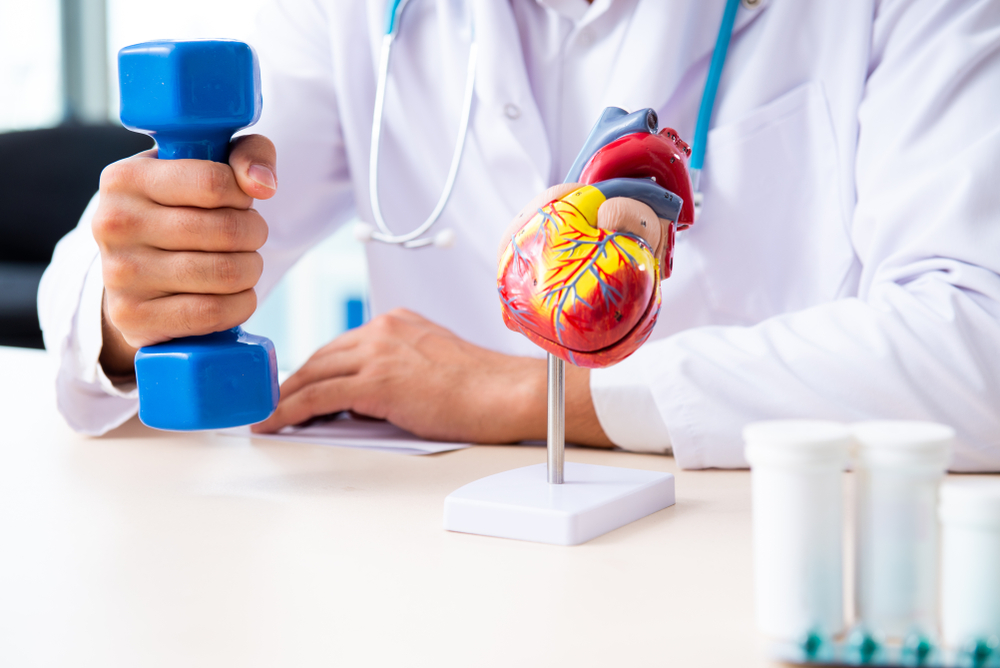 Young male doctor in sport and dieting concept