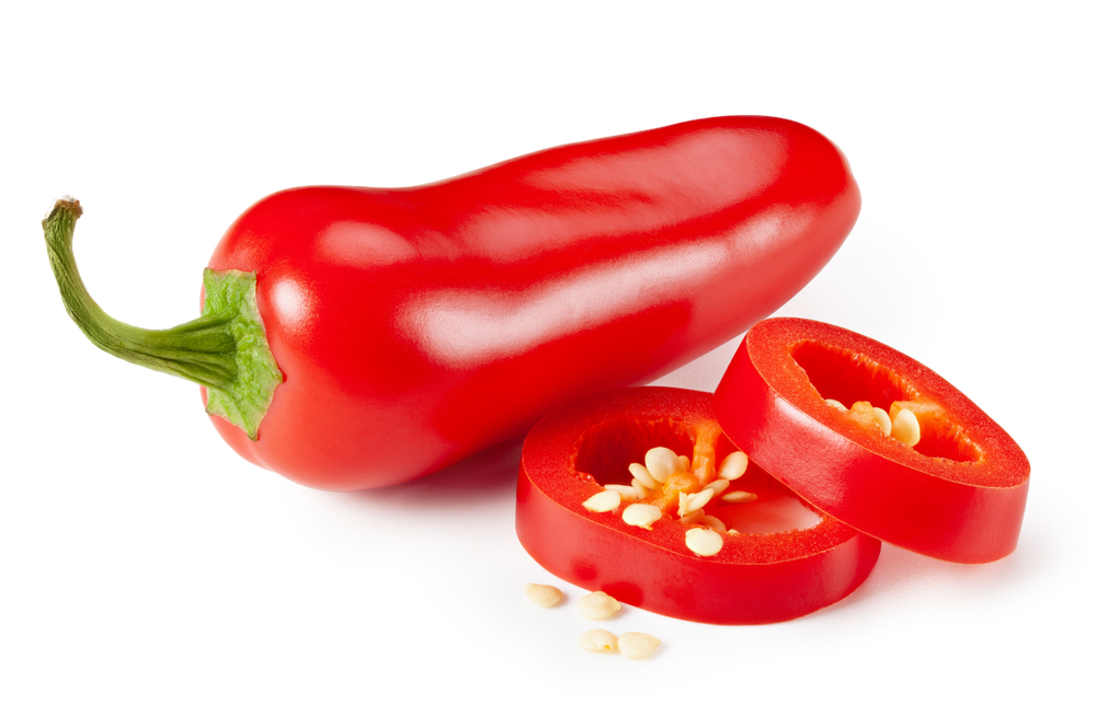 Red jalapeno peppers with sliced on white background