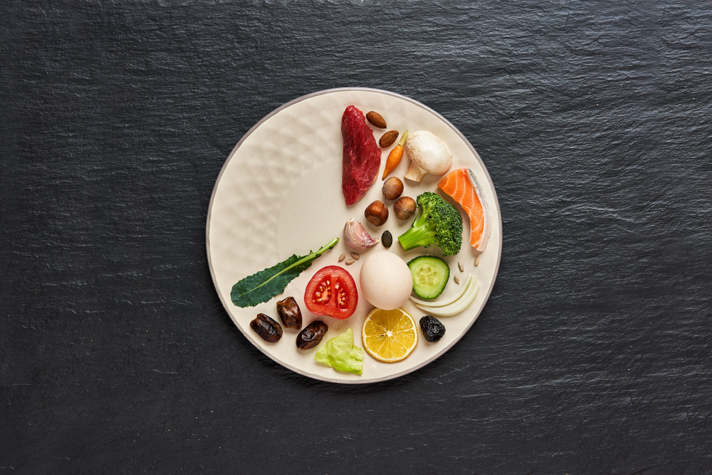 Selective focus of blue clock intermittent fasting  image as  window background,ketogenic diet, weight loss concept

