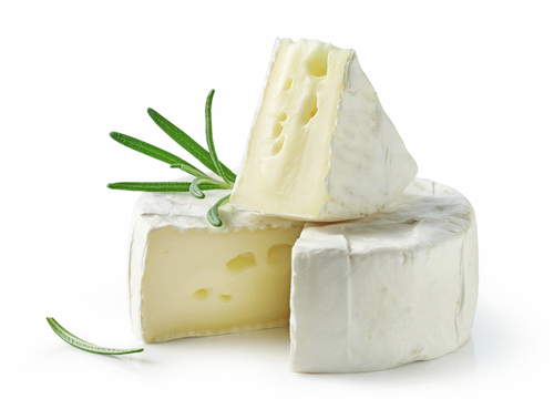 closeup of fresh brie cheese isolated on white background
