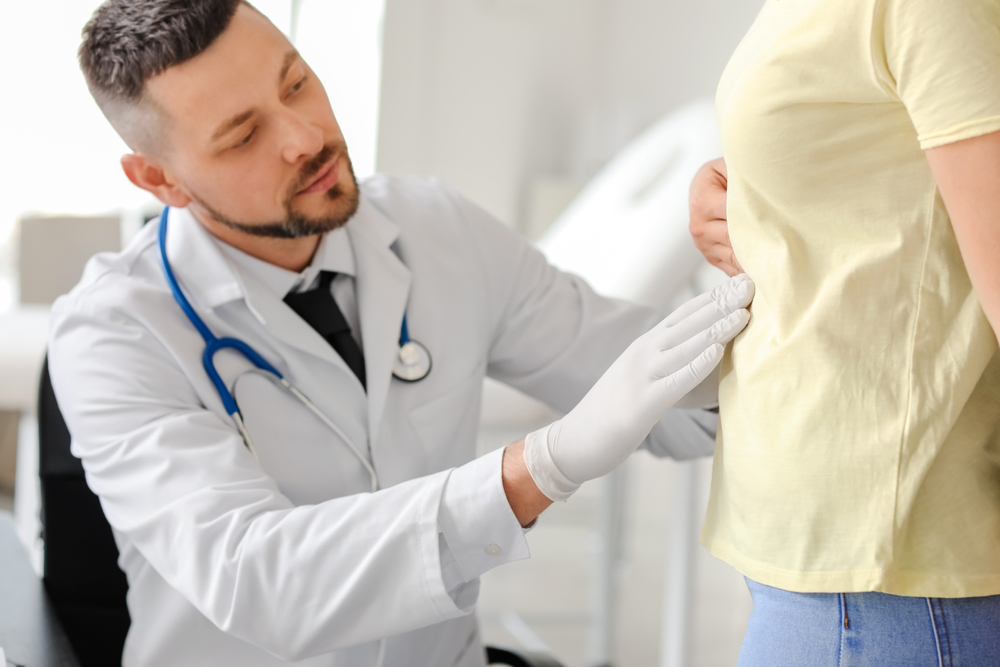 Woman visiting gastroenterologist in clinic