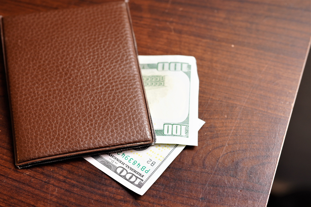 
Bill book with restaurant bill. Leaving a tip at the restaurant. Big tip for the waiter or cook.