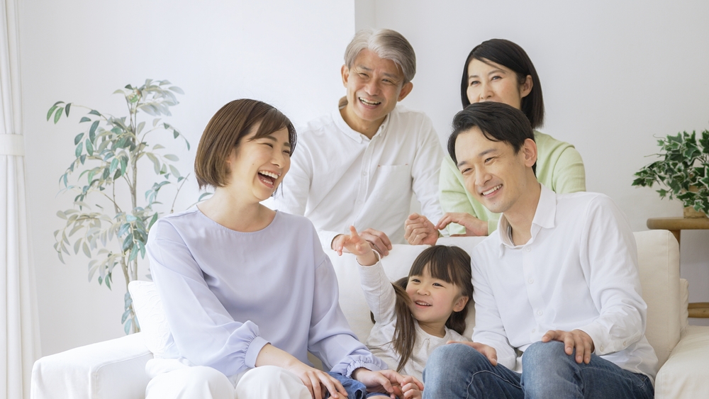 Asian family relaxing at home