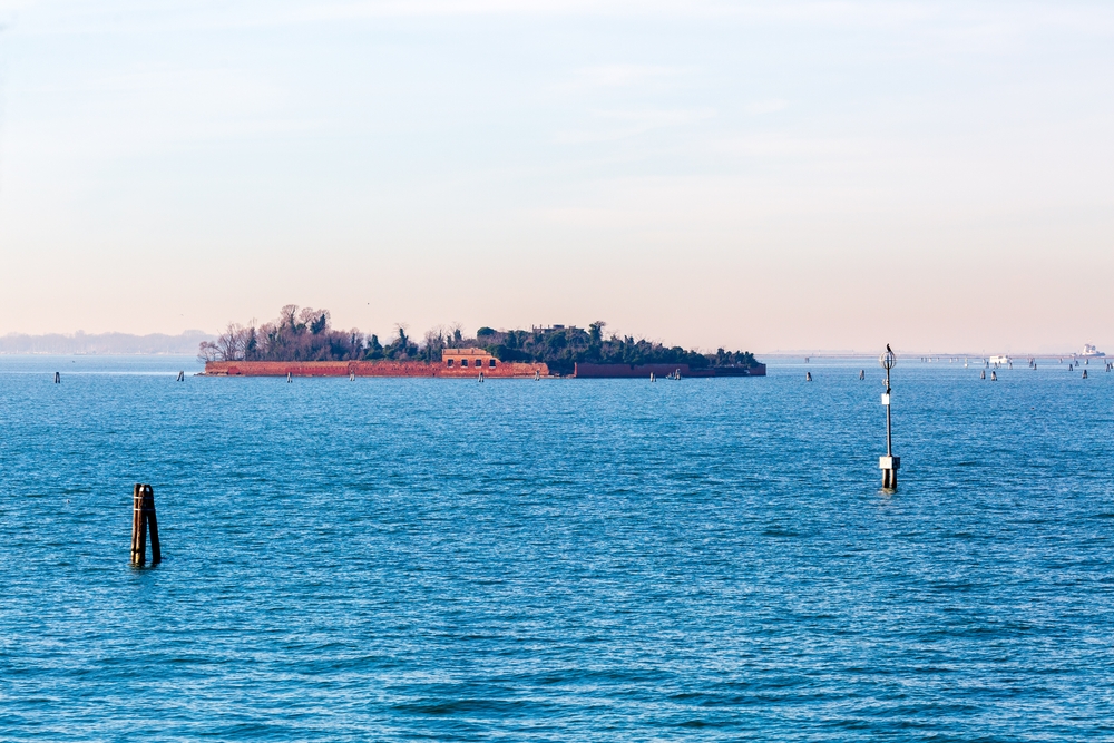 Venice, Italy - December 15 2021: View from Giudecca Channel. Island of San Giorgio in Alga
