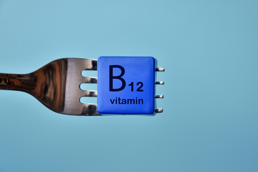 Vitamin B12 on the fork. Food with a high content of vitamin B