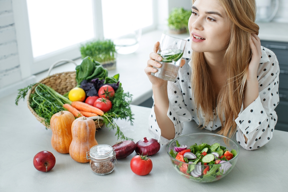 Healthy food woman. Beautiful woman eats a salad. High quality photo