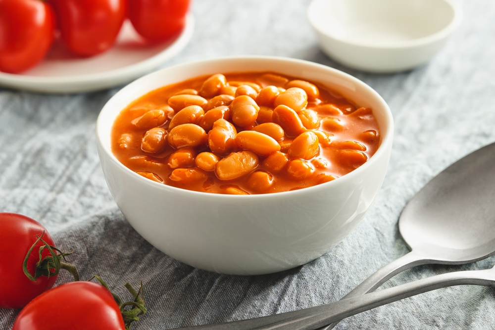 Bowl of cooked beans in tomato sauce