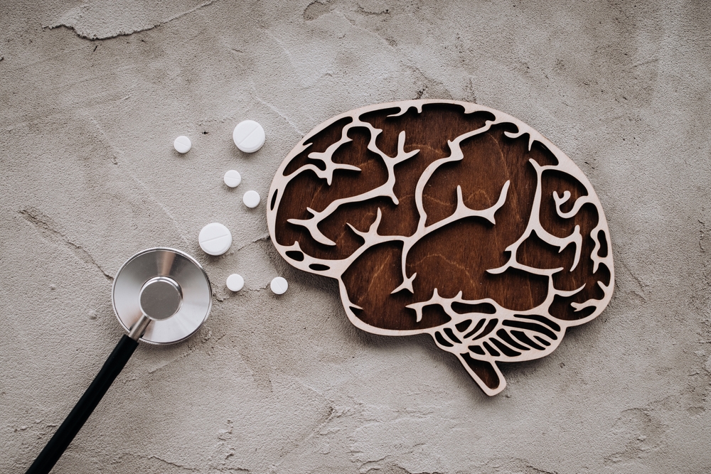 A stethoscope and brain with pills. Awareness of Alzheimer's, Parkinson's disease, dementia, stroke, seizure or mental health.