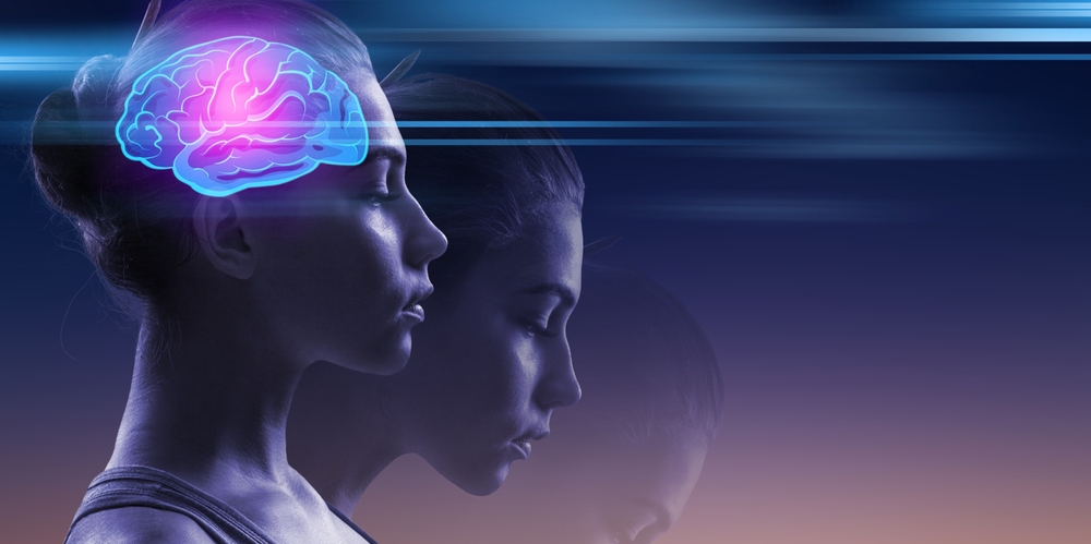 Young woman and neon light brain.

