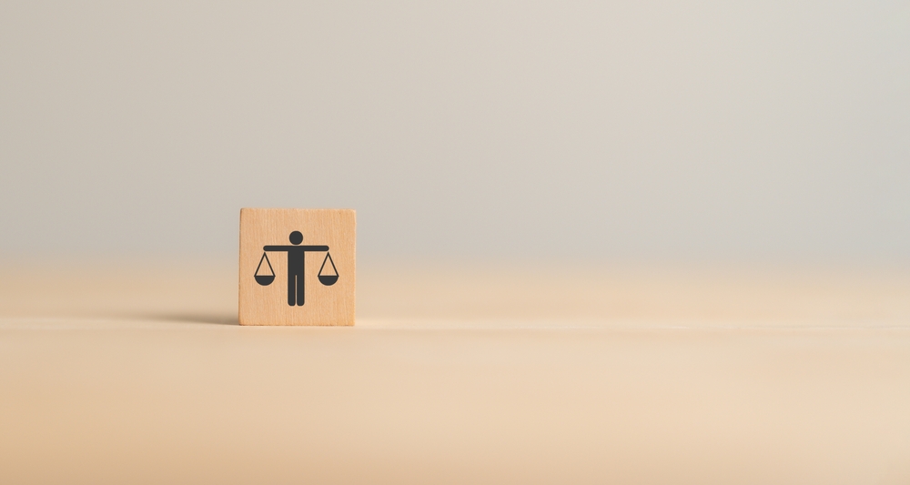 Business ethics concept. Business moral principles concept. Wooden cube blocks with "ETHICS" symbol on grey background and copy space. Banner for business integrity, good governance policy.
