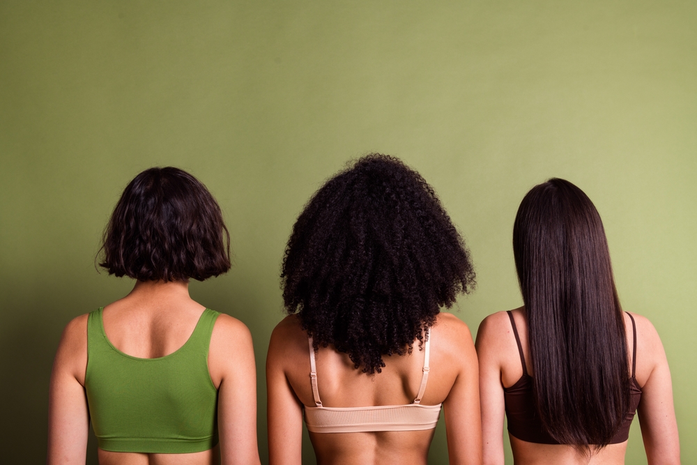 Studio photo of slim pretty ladies dressed lingerie standing back showing haircuts variety isolated pastel green color background