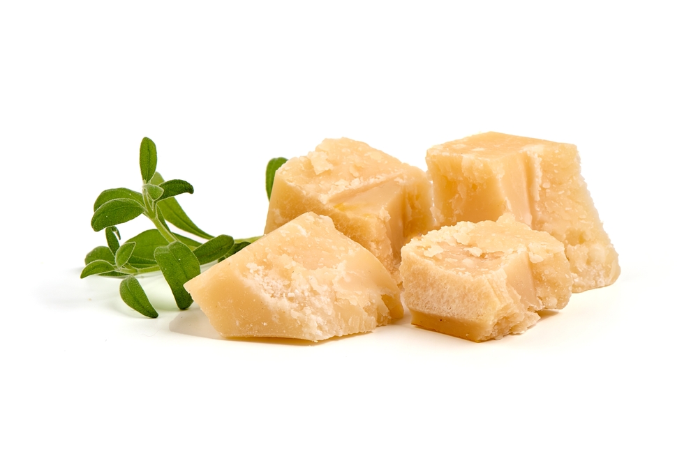 Parmesan cheese chunks, hard cheese, isolated on white background

