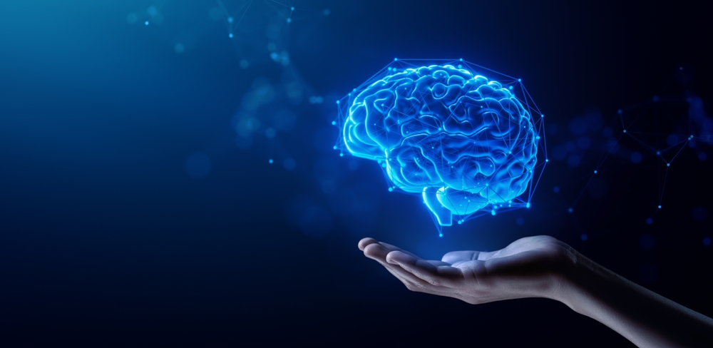 Hand Holding Human Brain - Futuristic Concept of Intelligence, science and mind
