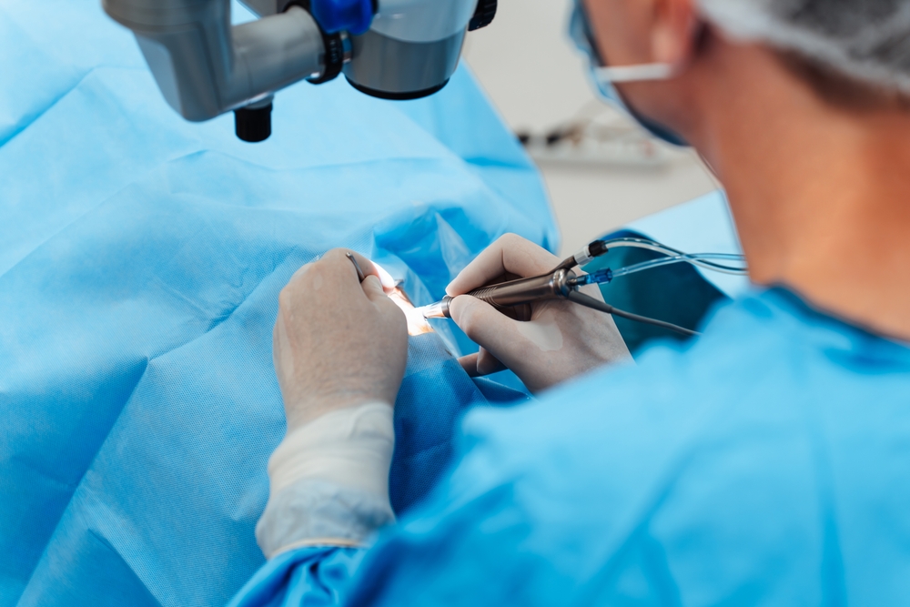 Skilled surgeon and his medical team performs precise eye surgery on an elderly patient, restoring vision with latest medical technology and cutting-edge techniques. Modern eye surgery concept.