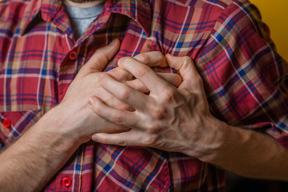 A young man suffering from heart pain