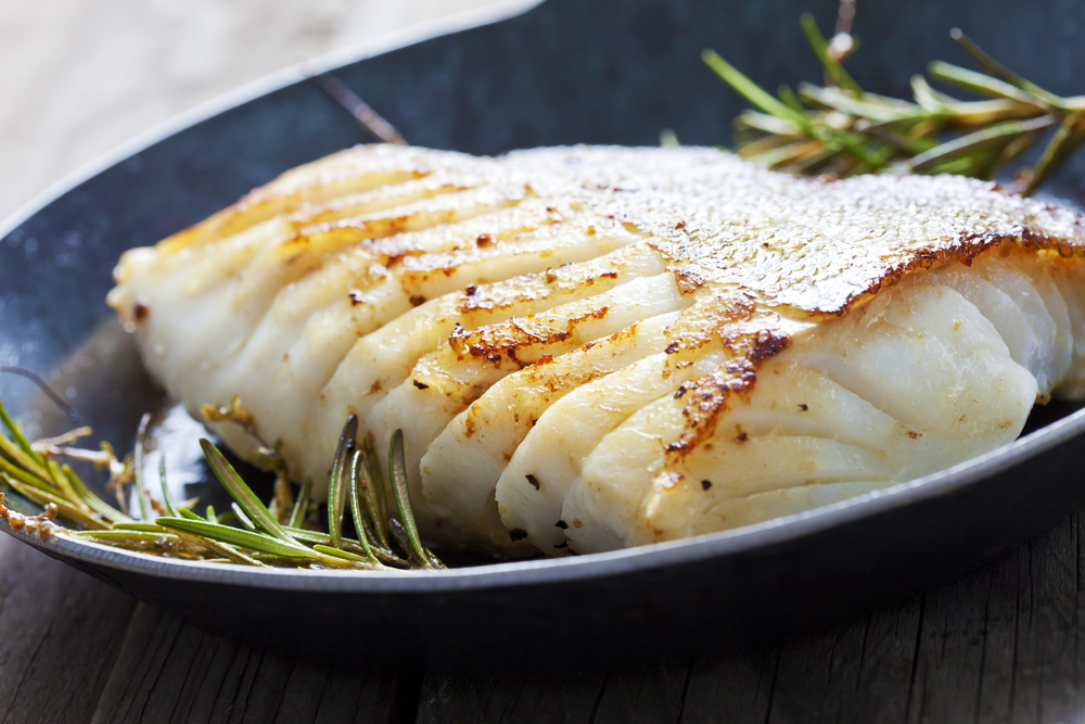 Fried fish fillet, Atlantic cod with rosemary in pan