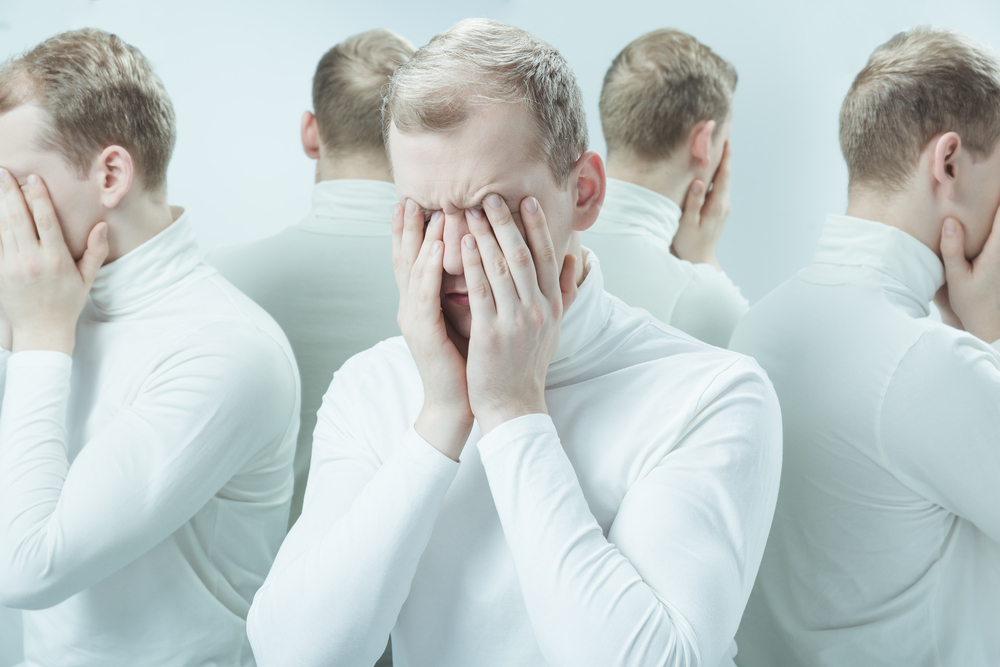 Man with mental problem covering his face with hands, duplicated image