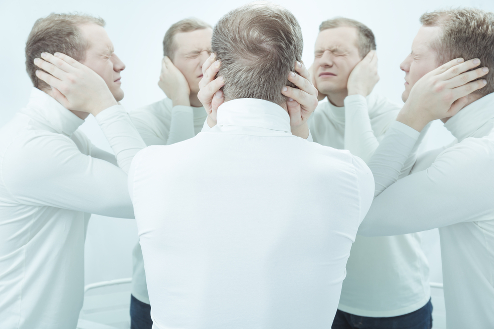 Shot of a young man hearing noise