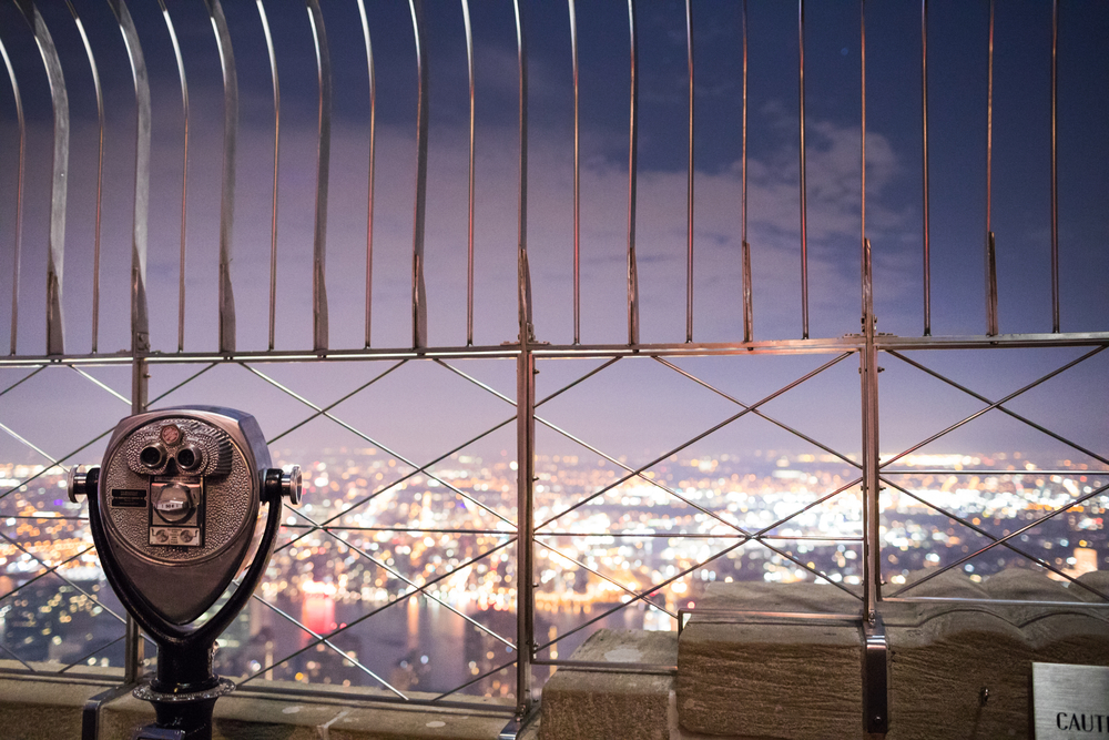 NEW YORK, USA - October 17, 2016. Binoculars on top of Empire State Building at Night in Manhattan, New York
