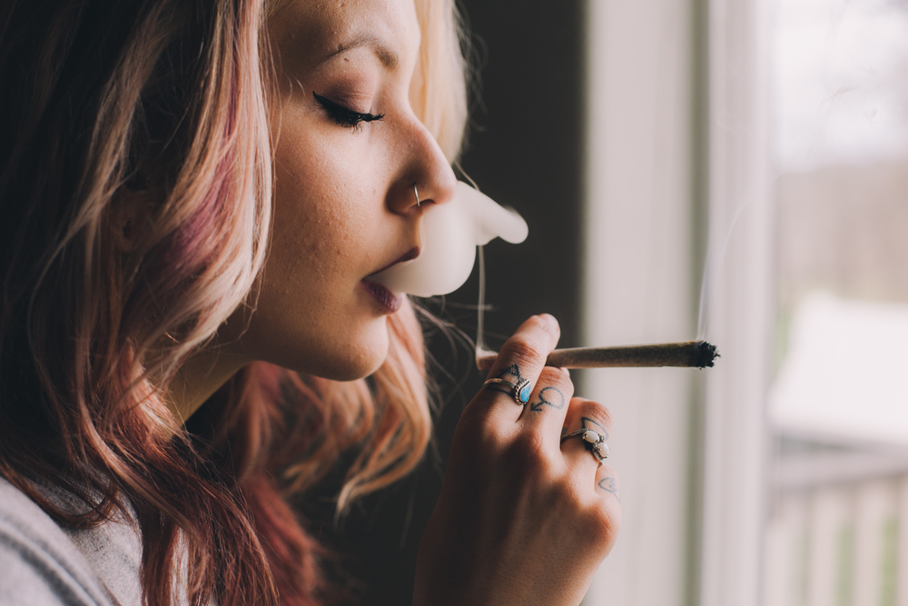 Beautiful Woman Smoking Cannabis Joint
