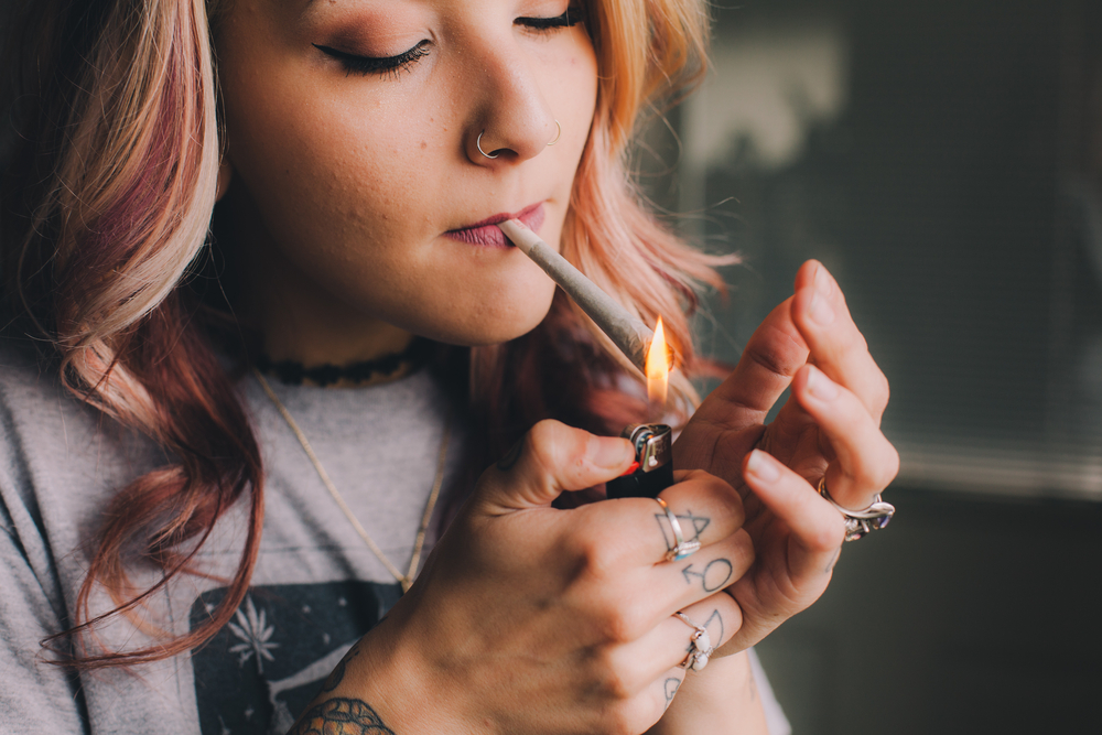 Beautiful Blonde Woman Smoking Cannabis Joint
