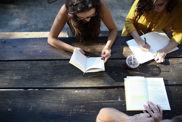 a group of people reading 