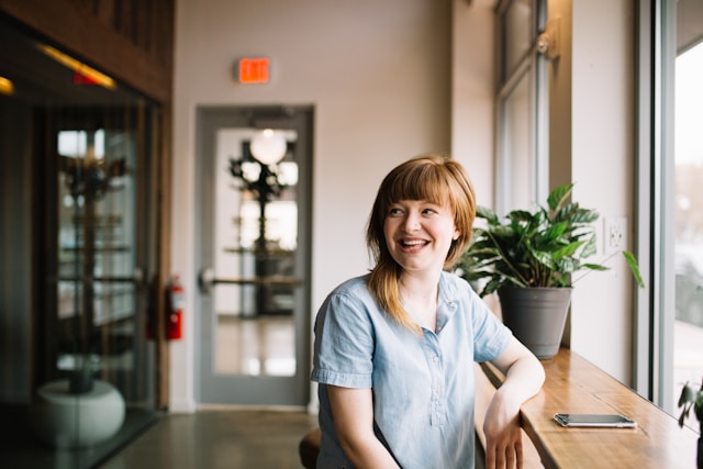 laughing woman at a table