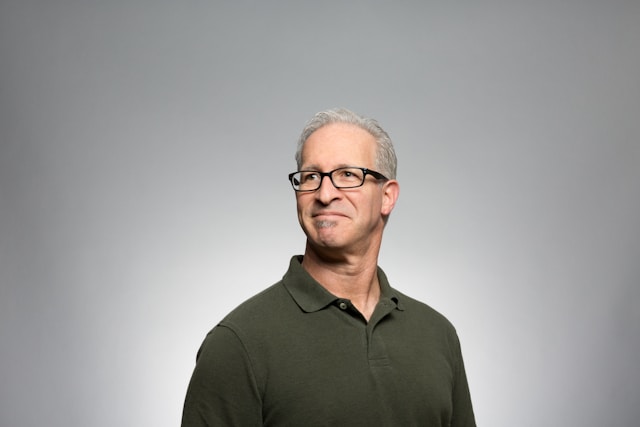 old man in green polo