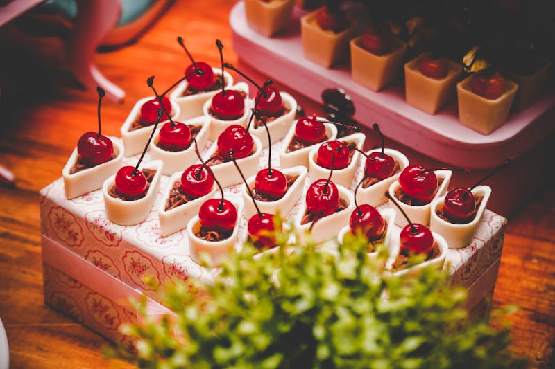 cherries on top of a cake