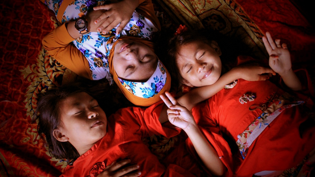 three children sleeping