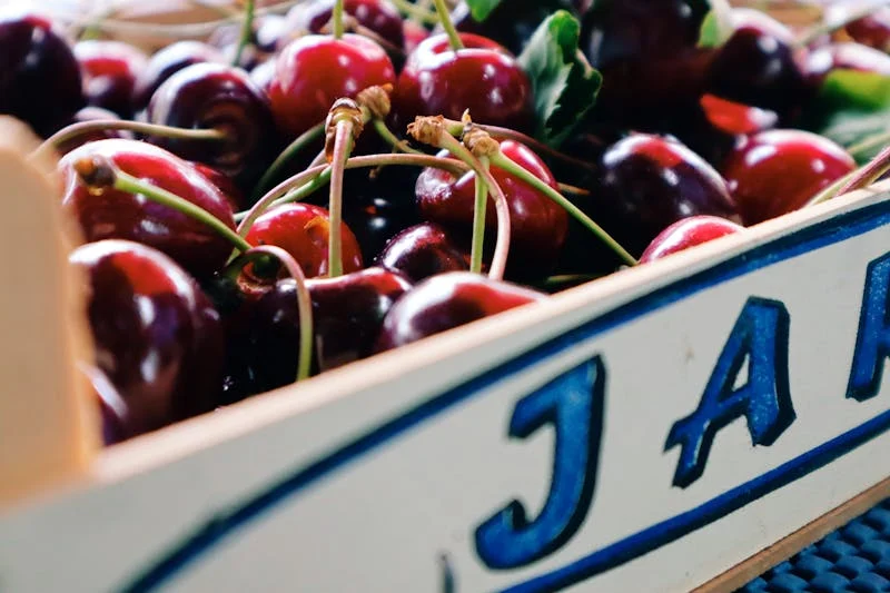 a container full of cherries