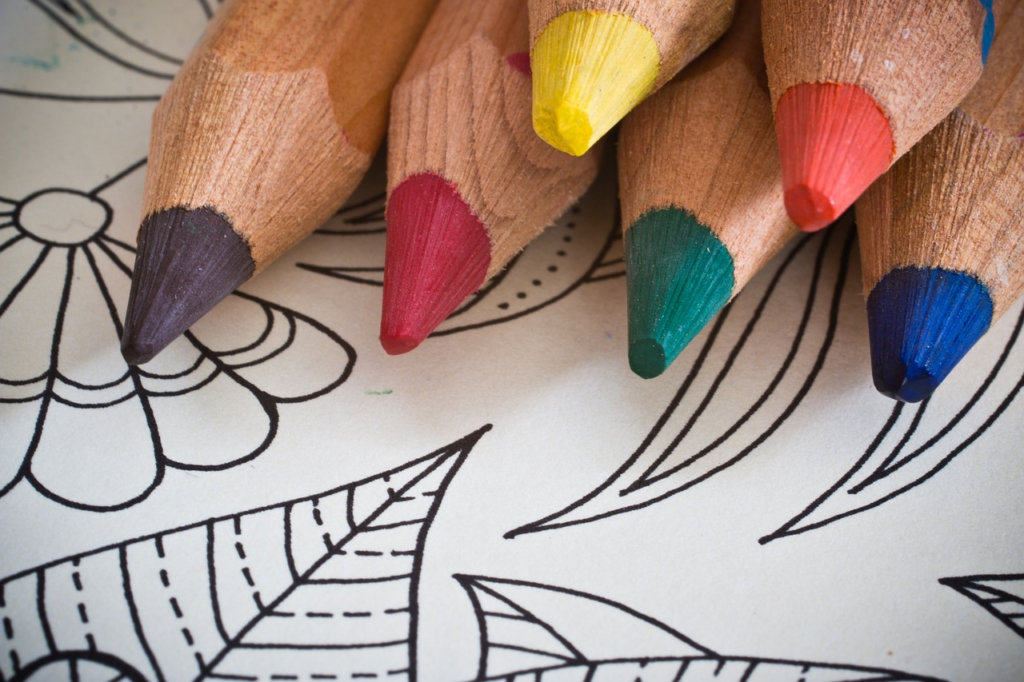 pencil crayons with a coloring book