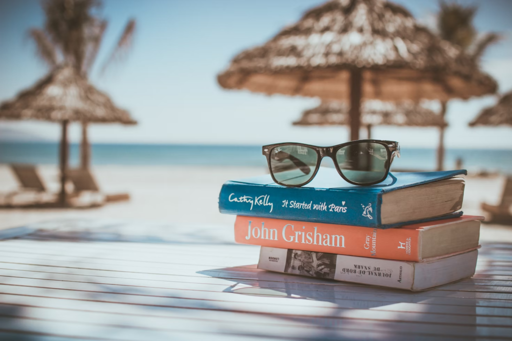 Stack of books and a sunglass