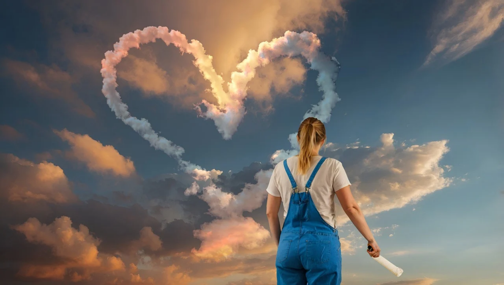 person looking at a heart in the sky