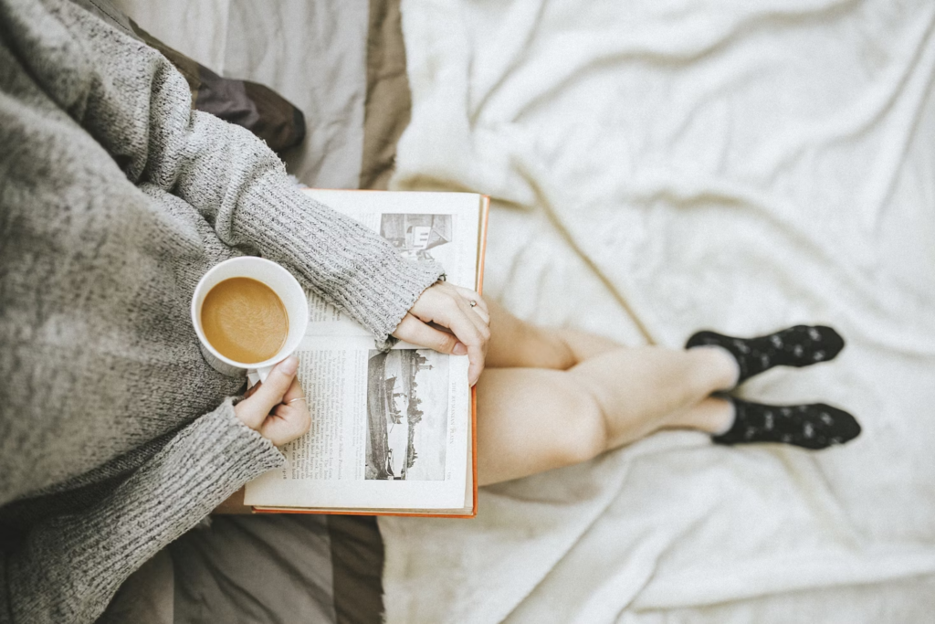 Person reading with a mug