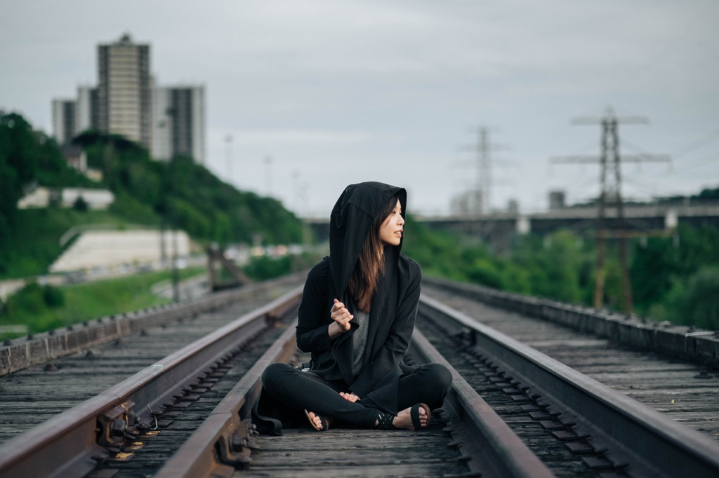 person sitting outside looking out