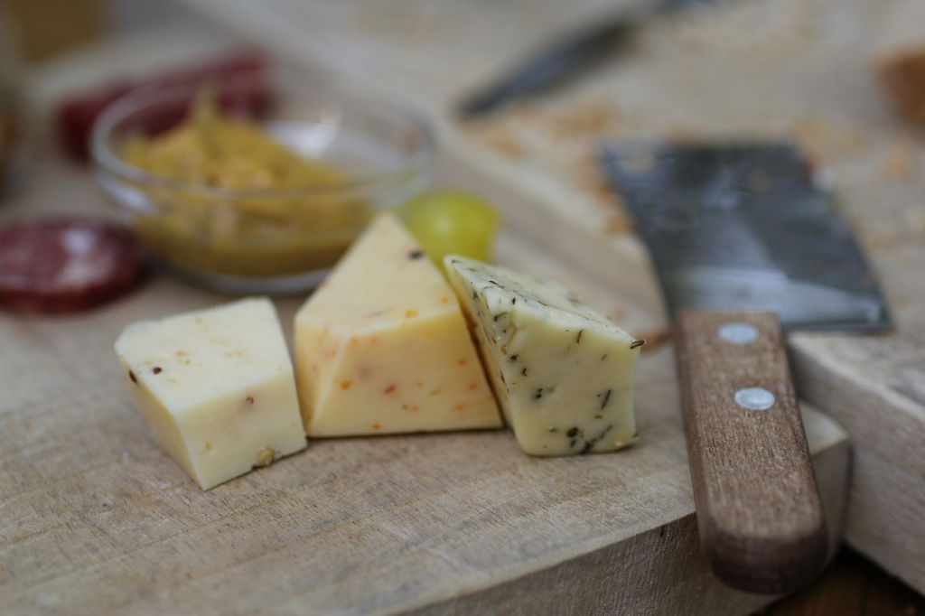 assorted cheeses of different colors