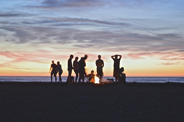 group of friends watching sunset 