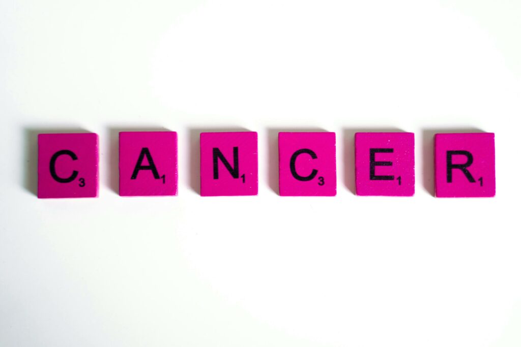 Cancer Word Spelled on Scrabble Tiles
