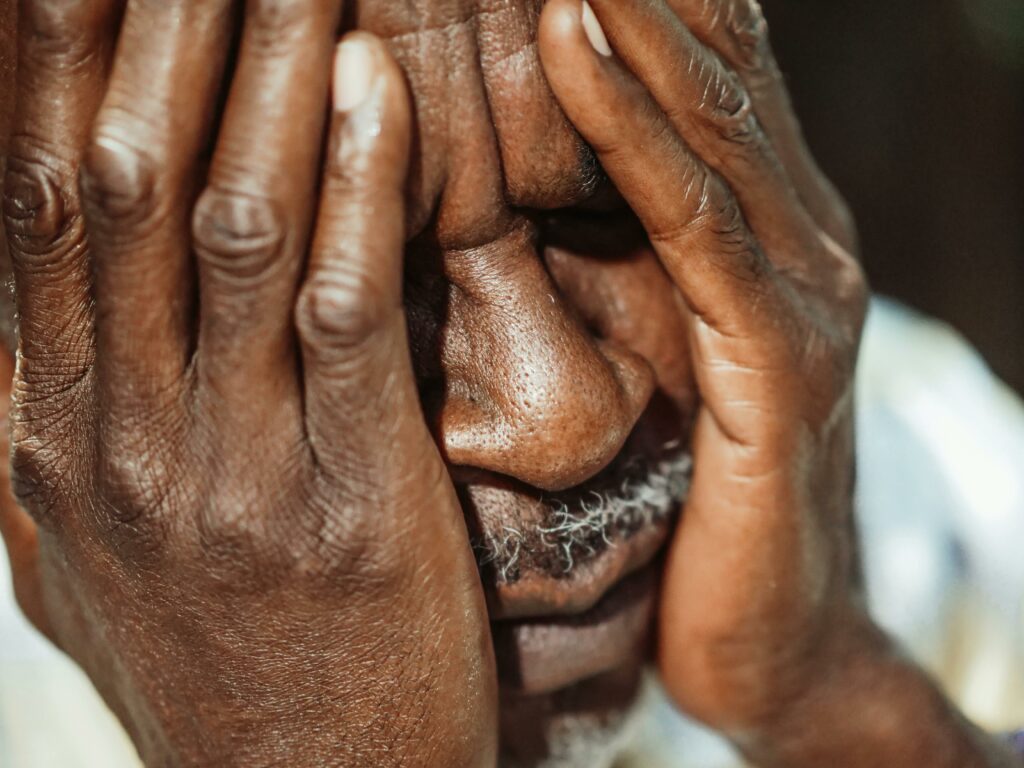 old man with haed in hands