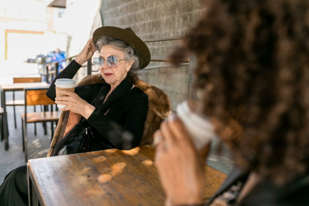 Woman in Black Long Sleeve Shirt Sitting on Chair